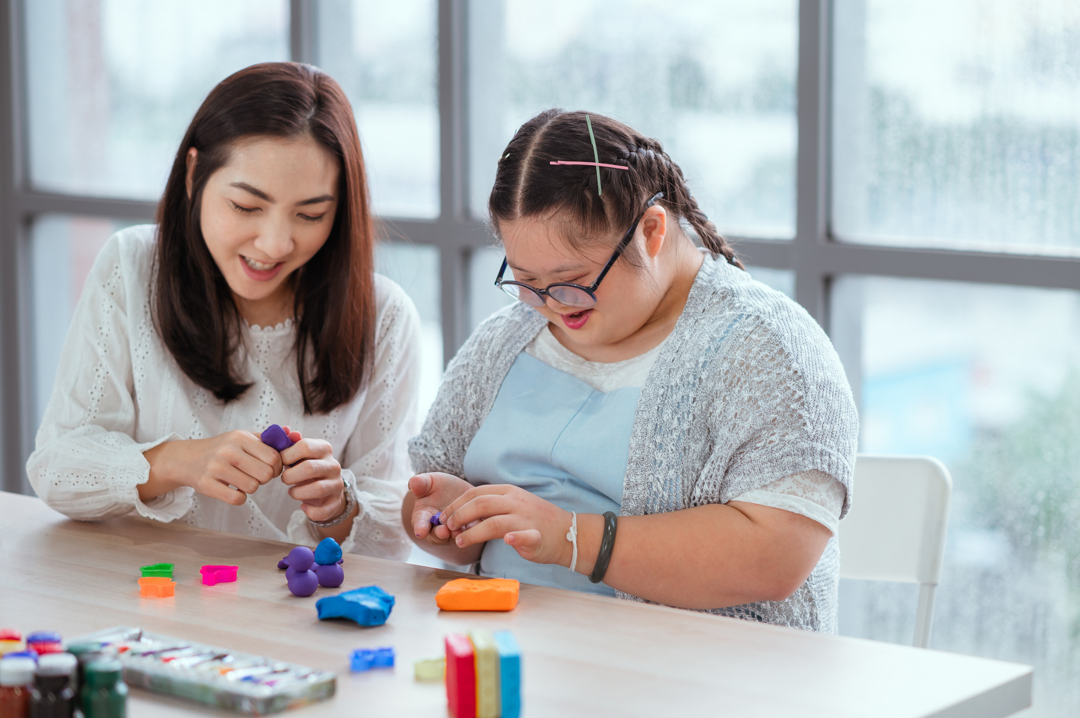 Autistic girl pursues a hobby of sculpting and painting.