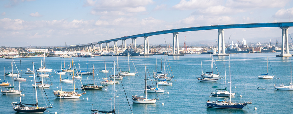 San Diego waterfront with sailing Boats - Industrial harbor and Coronado Bridge